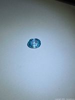 Loose oval seafoam blue zircon on white background