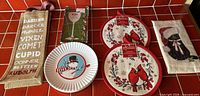 All five holiday kitchen items arranged on red tile surface