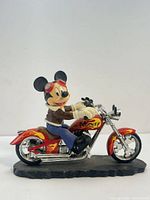 Front angle of Mickey Mouse resin figurine on motorcycle