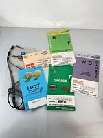 All five passes, plastic holder and lanyard displayed on surface