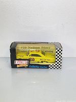 Front view of boxed Racing Collectables 1:64 car showing #29 Nelson Stacy and yellow car inside