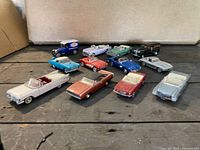 Overhead view showing all twelve diecast vehicles arranged on floor