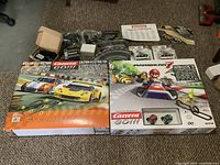 Overview showing both boxed sets, loose track parts, accessories and packaged cars