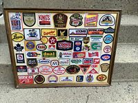 Full view of framed display showing all crests