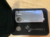 SoloPipe lighter, screen, brush inside case