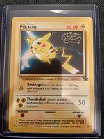 Front of Pikachu promo card in sleeve and holder