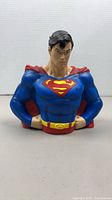 Front view of Superman PVC bust bank showing costume details and overall condition