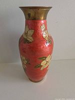 Full front view showing floral design and brass rim