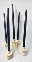 5-arm cream metal candelabra with black candles in place