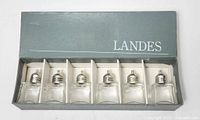 closed Landes box showing six shakers