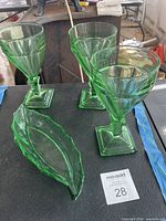 Three green Heisey Twist goblets with square bases and one matching oblong dish
