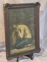 Full view of framed sepia print showing subject and frame