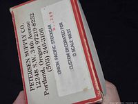 End of box with Petersen Supply Company address and product label