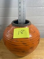 Full view of vase with ruler showing height