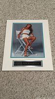 Front view of signed matted photo plaque showing full layout and autograph