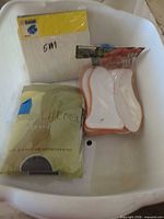 All three packaged items in bin