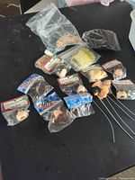 Overview of lot showing sealed doll heads and hairpieces