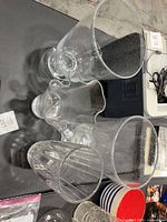 Top view of all four clear glass vases showing shapes and textures
