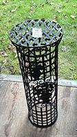 Full view of cylindrical wrought iron pedestal