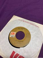 Label side showing "100 I Dream" on A&M brown label in paper sleeve