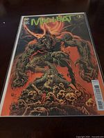Front cover of Man-Bat #5 comic in bag with board