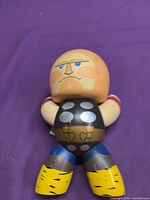 front view of the vinyl figure showing colors and design