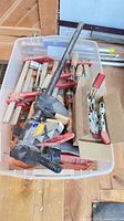 Overall view of bin with assorted clamps