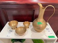 Entire set showing pitcher and three bowls