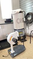 Full view of Craftex CX404 dust collector assembled in garage