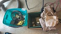 turquoise tote, green crate, beige coat