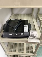 Top view of George Foreman grill on shelving