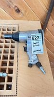 Full view of Husky air impact wrench showing size and attached air fitting
