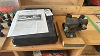 Dowel maker body, carrying case, manual visible