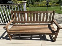 Front view of the wooden 2-seat bench on deck