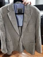 Full view of gray linen Bugatti blazer on hanger