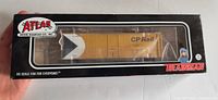 Atlas Trainman box showing yellow CP Rail boxcar through clear window
