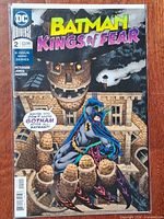 Front cover of Batman: Kings of Fear #2 in bag with board