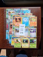 Stack of sleeved Pokémon cards on table