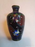 Front view showing floral cloisonné design and overall form