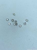 Loose round brilliant diamonds spread on surface