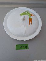 Top view of covered dish showing carrot motif