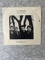 Front picture sleeve with U2 band portrait and title