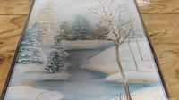 Full view of framed winter landscape painting
