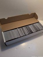 Open 800-count card storage box filled with sleeveless trading cards