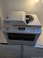 Full view of Brother MFC-7360N printer showing overall condition and included power cord