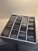 Three-row cardboard box filled with MTG cards