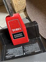 Close-up of Toro Power Shovel label on auger housing