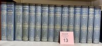 Full spine view of all fifteen volumes showing uniform binding and titles