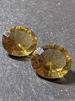 Front view of both round smokey quartz stones