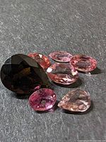 All six tourmaline stones on dark background